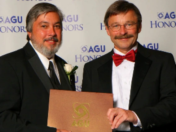 Julio Betancourt receiving an award