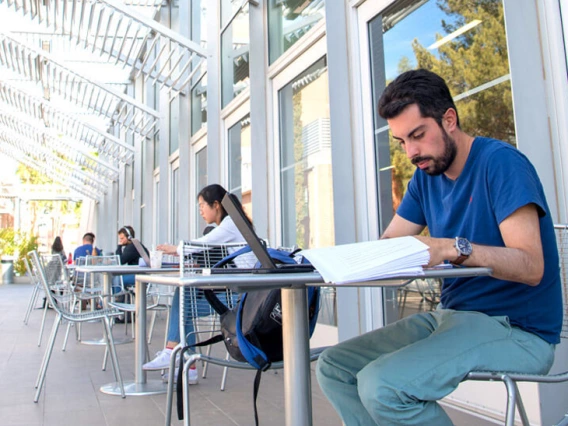 students working at spaced tables