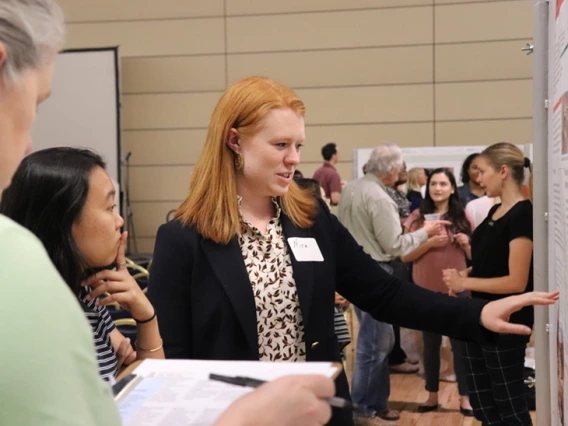 people discussing at a board