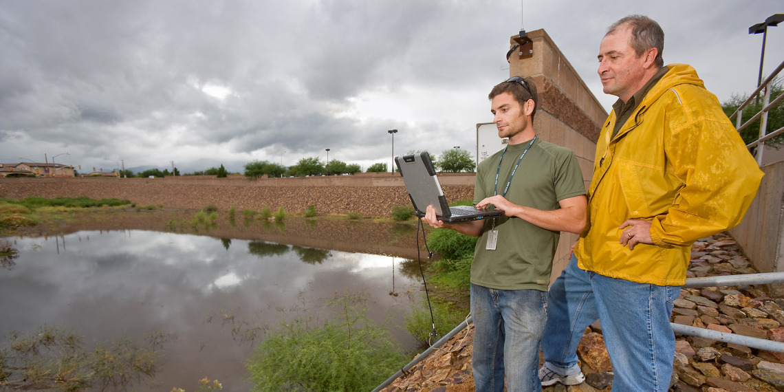 David Goodrich and technician monitor hydrologic systems